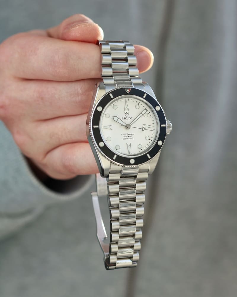 Hand holding a Escudo Ocean Seacrest Black Ice Silver Dial Watch 